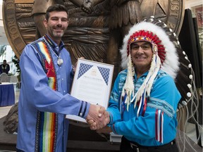 Mayor Don Iveson presents a proclamation to Grand Chief Wilton Littlechild during Treaty No. 6 Recognition Day at City Hall, in Edmonton Friday Aug. 17, 2018. The day marks the historic partnership between the Confederacy of Treaty Six First Nations and the City of Edmonton. Photo by David Bloom