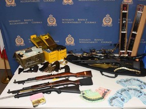 Items allegedly seized from a Medicine Hat man at the centre of a hate crimes investigation. Supplied photo