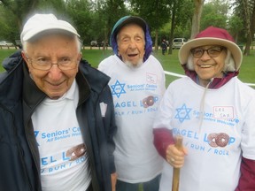 At the start line of the inaugural. city-wide Walk, Run and Roll one-km race in Victoria Park, organized by outstanding older athletes from the Jewish Senior Citizens drop-in Centre, are (l to r) gold medallist Edward Mickelson, 90, and Don Sax, 94. and wife Lee Sax, 88. Their message to the world: "Getting old is fun - but don't expect others to entertain you."