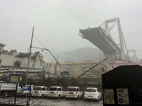 This handout picture provided by the Italian police (Polizia di Stato) on August 14, 2018 shows a collapsed section of a viaduct on the A10 motorway in Genoa.
