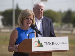 Alberta Premier Rachel Notley and Kinder Morgan Canada president Ian Anderson speak during a ground breaking ceremony at the Trans Mountain stockpile site on the Enoch Cree Nation west of Edmonton on July 27, 2018.