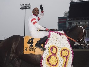 Rico Walcott celebrates a top Sky Promise after they won the Canadian Derby in Edmonton August 25, 2018.