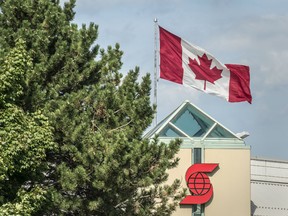 The Canadian flag flies over a Scotiabank location at Warden Avenue and Highway 7 near where the Vendome Condo project will be built in Markham, Tuesday August 28, 2018. The principle, enshrined in Canadian law, that anyone born on Canadian soil is automatically a citizen for life — unless at least one of the child’s parents is a Canadian citizen or permanent resident, was unusually, if predictably, heated