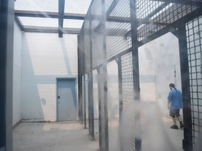 A prisoner paces in a recreational yard in a photo supplied by a Senate committee that recently toured the prison. Correctional Service Canada has been probing staff misconduct at the facility for nearly a year. Eleven people have either quit, been fired, or suspended since the investigation began.