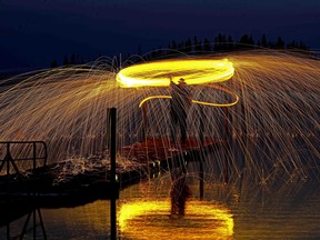 A member of the St. Albert Photography Club participates in a light painting photography session at Elk Island National Park on August 19, 2018. The club, which has approximately seventy members, has been in existence since 1992 and meets at the St. Albert Inn & Suites three times a month. (PHOTO BY LARRY WONG/POSTMEDIA)