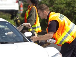 Marc Renaud, in a 2013 file photo, collected donations in one of his boots during Fill The Boots, a fundraiser for muscular dystrophy. Colleagues are now mourning after Renaud's off-duty death on Aug. 26, 2018.