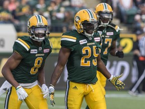 Edmonton Eskimos Shaquille Cooper celebrates his touchdown over the Montreal Alouettes with Kenny Stafford (8) and Derel Walker (87) during first half CFL action in Edmonton, Saturday, Aug. 18, 2018.
