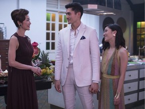 Michelle Yeoh, from left, Henry Golding and Constance Wu in a scene from the film Crazy Rich Asians.