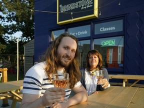 Joses Martin (left), general manager of the Grindstone Comedy Theatre and Bistro, enjoys a glass of wine with Edmonton Journal wine columnist Juanita Roos (right). The Grindstone Comedy Theatre is a venue for the 2018 Edmonton Fringe Theatre Festival.