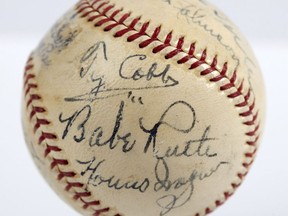 In this undated photo provided by SCP Auctions is a baseball with the signatures of Babe Ruth, Ty Cobb, Honus Wagner and eight other legends of the game that has sold for more than $600,000. The players all signed the ball on the same day in 1939, when they had gathered to become the first class to enter the Baseball Hall of Fame. SCP Auctions said Monday, Aug. 13, 2018, that it has sold for just over $623,000. That crushes the previous record of $345,000 for a signed ball, set in 2013.