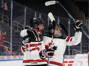 Canada's Josh Williams (15) and Jamieson Rees (10) celebrate a goal during third period Hlinka Gretzky Cup action against Slovakia, in Edmonton on Aug. 7, 2018. Canada won 4-2.