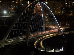 The Walterdale Bridge is seen at night from the south side of the North Saskatchewan River in Edmonton.