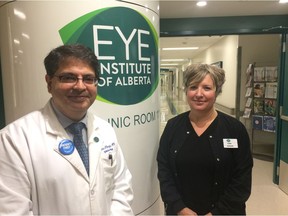 Dr. Karim Damji, chief of ophthalmology at the Royal Alexandra Hospital, left, and Karen Harris, patient care manager for ophthalmology, stand at the entrance to the newly renovated Eye Institute of Alberta on Wednesday, Aug. 22, 2018.