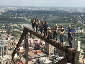 Members of Ironworkers local 720 work on Edmonton's Stantec Tower, Canada's tallest office building outside Toronto on Thursday, Aug. 2, 2018.