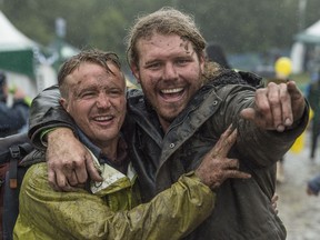 Connor Robertson and Jesse Melville embraced the rain and mud.