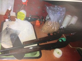 A crime scene photo of guns police discovered while searching a trailer linked to a suspect in a 2016 shooting in Calling Lake, Alta. were entered as exhibits during a trial in Edmonton in August 2018.