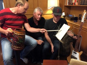 Randy Rink, Gord Steinke and Mark Scholz getting ready for their gig at Rock Fest Saturday.