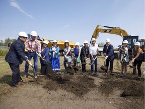Premier Rachel Notley, Enoch Cree Nation Chief Bill Morin, Minister of Infrastructure and Communities Amarjeet Sohi and Kinder Morgan Canada president Ian Anderson, break ground with other dignitaries during a  ceremony at the Trans Mountain stockpile site in Edmonton on Friday, July 27, 2018.