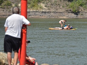 The lazy days of summer as two people float along the North Saskatchewan River in Edmonton, August 6, 2018. Ed Kaiser/Postmedia