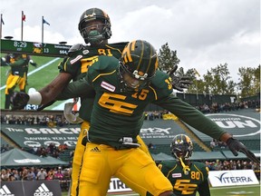 Edmonton Eskimos D'haquille Williams (81) celebrates his touchdown with Vidal Hazelton (15) against the Calgary Stampeders during CFL action at Commonwealth Stadium in Edmonton, September 8, 2018.