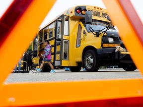 School children take part in the 12th annual First Riders event at Northlands, in Edmonton Thursday Aug. 31, 2017. The First Riders program helps students become familiar and comfortable with the bus riding experience before the first day of school. Photo by David Bloom