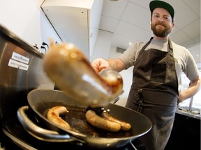 Salz co-owner and chef Allan Suddaby cooks sausage at the restaurant, located at 10556 115 St.