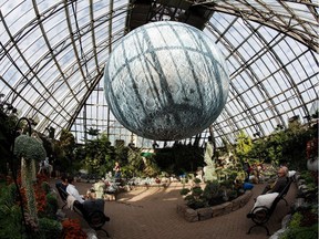 People check out the giant moon during Goodnight Moon at the Muttart Conservatory in Edmonton on Wednesday, Sept. 5, 2018.