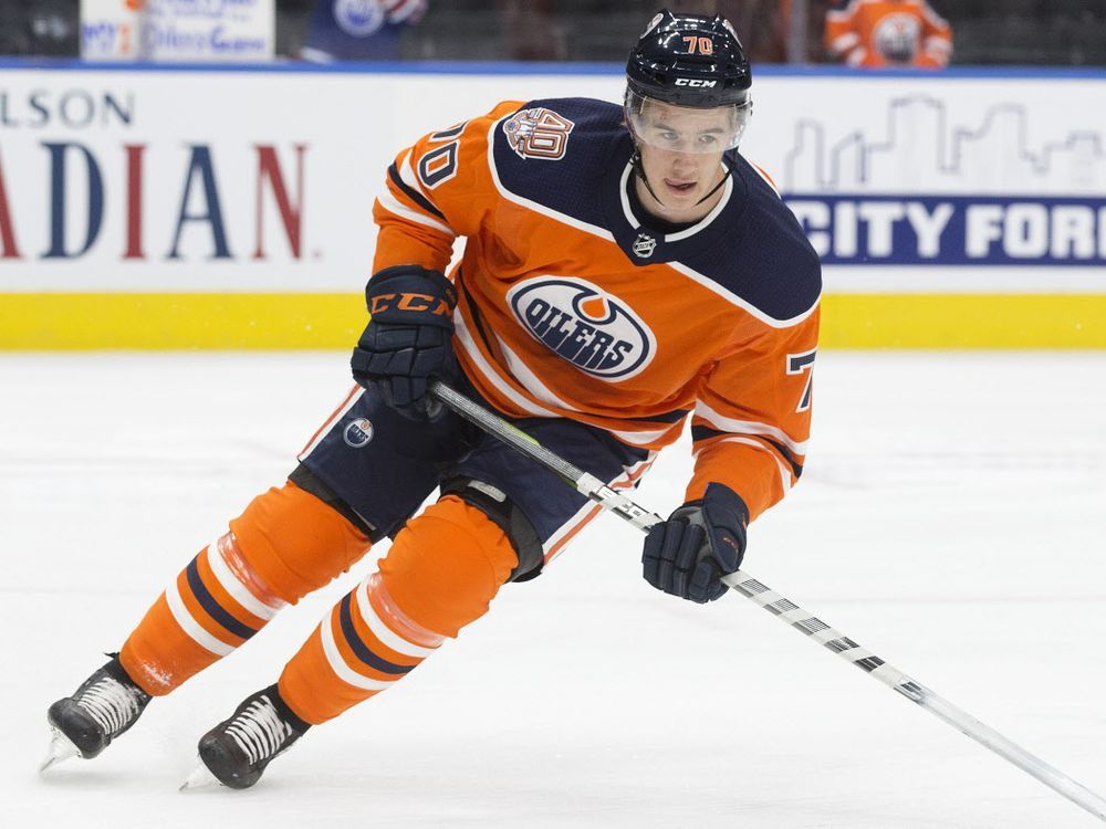 Edmonton Oilers' Ryan McLeod (71) moves the puck against the Carolina  Hurricanes during the first period of an NHL hockey game in Raleigh, N.C.,  Sunday, Feb. 27, 2022. (AP Photo/Karl B DeBlaker