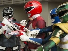 Visitors to the Edmonton Comic & Entertainment Expo pose for photos dressed as the Power Rangers.