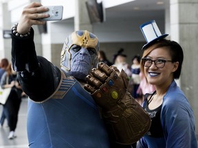Calvin Toft and Bianca Yan talk a selfie during the Edmonton Comic & Entertainment Expo, in Edmonton Sunday Sept. 23, 2018. Photo by David Bloom