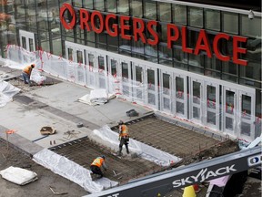 Crews work on the Ice District public plaza, in downtown Edmonton Thursday Sept. 27, 2018.
