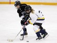 (left to right)The Ice Guardians' Adrianna Berg battles the St. Albert Storm Violet Brady during Minor Hockey Week action at Coronation Arena, 13500 112 Avenue, in Edmonton Saturday, Jan. 13, 2018. File photo.