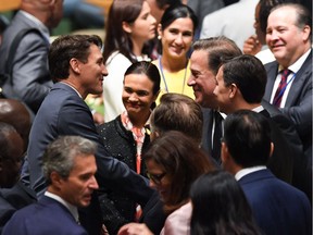 Canadian Prime Minister Justin Trudeau (L) arrives on the floor of the United Nations General Assembly at the United Nations building in New York on September 24, 2018.