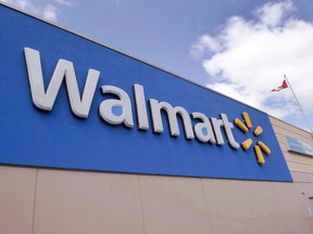 Signage at a Laval, Que., Walmart store is seen on May 3, 2016. Alberta Health Services says it has reached an agreement with Walmart Canada in a case where the retailer is accused of keeping and selling food that was potentially contaminated by the Fort McMurray wildfire.