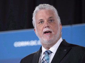Quebec Premier Philippe Couillard delivers a luncheon speech in Montreal on Thursday, June 21, 2018. There's speculation that Couillard may trigger Quebec's general election campaign several days earlier than planned.THE CANADIAN PRESS/Paul Chiasson