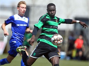 Foothills FC forward Moses Danto (R) scores on his club's first shot on net during exhibition PDL soccer action between Foothills FC and FC Edmonton Academy in Calgary on Saturday, May 5, 2018.