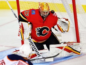 Calgary Flames goaltender David Rittich gives up a goal to Evan Bouchard of the Edmonton Oilers during NHL pre-season hockey at the Scotiabank Saddledome in Calgary on Monday, September 17, 2018. Al Charest/Postmedia