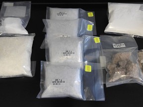Edmonton police seized a quantity of ketamine, cocaine and MDMA after searching four properties and a vehicle on Sept. 20, 2018. Police also seized more than 3,700 pills (in the four bags at centre) that appear to be Xanax but are actually a fentanyl analog.