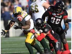 Edmonton Eskimos running back C.J. Gable (2) fumbles the ball as he is tackled by Ottawa Redblacks defensive back Anthony Cioffi (24) during first half CFL football action in Ottawa on Saturday, Sept. 22, 2018.