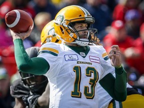 Edmonton Eskimos quarterback Mike Reilly throws the ball during second half CFL football action against the Calgary Stampeders in Calgary, Monday, Sept. 3, 2018.