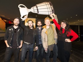 Entertainers Keenan Kirk,  left, Ryan Maier, Jay Sparrow, Martin Kerr and Celeigh Cardinal hold a cardboard cut-out of the Grey Cup after the the full festival entertainment lineup for Grey Cup was announced on Wednesday, Sept. 19, 2018 in Edmonton.