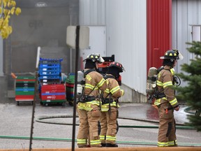 Firefighters on the scene of a fire in the Roper industrial area at Drader Manufacturing, 5750 50 St. in Edmonton on Thursday, Sept. 6, 2018.