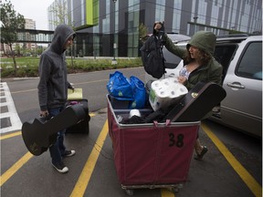 Second year music student, Francesco Rizzutl gets some help from his mom, Rosa Rizzutl as he prepares to move into MacEwan University Student Residence on Saturday. Francesco and his family are from Fort McMurray.