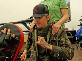 Landon Smith does some exercises at the ReYu Paralysis Recovery Centre in Edmonton on Monday, Sept. 10, 2018. Smith was paralyzed from the chest down after he broke his neck at a trampoline park in Sherwood Park in January 2017.