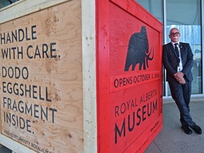 Chris Robinson, executive director of the Royal Alberta Museum, stands next to a crate used as a prop at a news conference on Sept. 13, 2018, announcing the Oct. 3 opening date of the new museum.