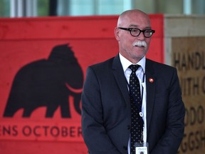 Executive director Chris Robinson next to a crate used as a prop at a news conference on the much-anticipated opening date of the new downtown Royal Alberta Museum on  Sept. 12, 2018.