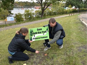 Simone Klann, left, and Jim Rickett are two members of a local group raising awareness by posting lawn signs and gathering opposition to what they worry are larger expansion plans by Epcor at Gold Bar Park in Edmonton on Friday, Sept. 14, 2018.
