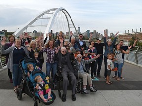 John Walter, 94, sitting centre, is the grandson of early settler John Walter. His wife Lora Walter and other family descendants pose with Mayor Don Iveson at the grand opening ceremony of the new Walterdale Bridge on Thursday, Sept. 6, 2018.