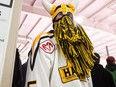 A Nipawin Hawks fan rounds the corner into the lobby at first intermission at the Nipawin Centennial Arena during a game between the Nipawin Hawks and the Estevan Bruins as the SJHL resumes following the collision involving the Humboldt Broncos hockey team bus that resulted in the death of 16 people.