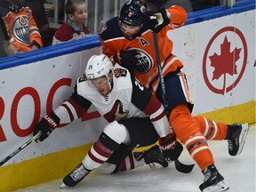 Edmonton Oilers Adam Larsson (6) tries to pen in Arizona Coyotes Nick Cousins (25) during NHL preseason action at Rogers Place in Edmonton, September 27, 2018. Ed Kaiser/Postmedia